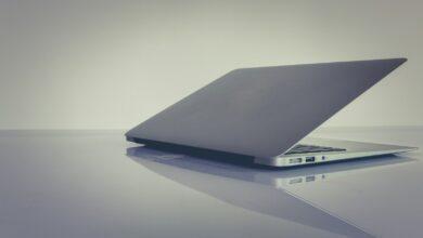 white and black laptop computer