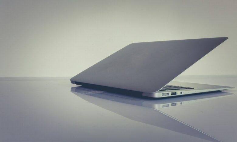 white and black laptop computer