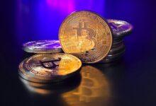 a pile of bitcoins sitting on top of a table