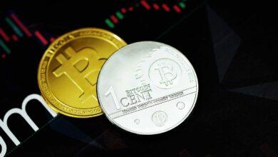 gold round coin on black surface