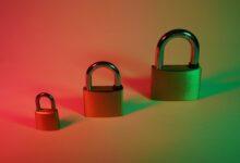 two brown padlock on pink surface