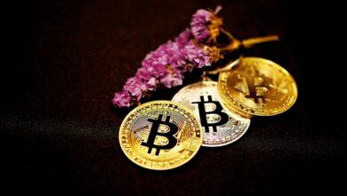 gold round coin on black textile
