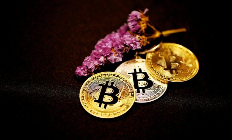 gold round coin on black textile